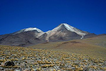 Uturuncu is a cone in a desolate landscape, with an adjacent smaller non-conical mountain.