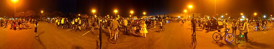 panorama of San Jose Bike Party including crowd with lots of bicycles at a regroup point on June 21, 2019