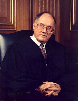 Rehnquist seated in robes