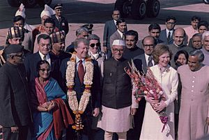 Officials of India welcome Jimmy Carter and Rosalynn Carter during an arrival ceremony in New Delhi, India - NARA - 177371