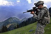 ISAF soldier looking for enemy positions in Kunar Province of Afghanistan
