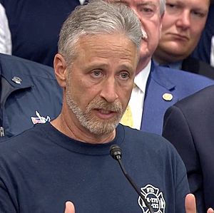 Jon stewart speaks at the press conference held after the passage of September 11th Victim Compensation Fund Act.jpg