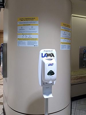 Hand sanitizer and signs at Los Angeles International Airport