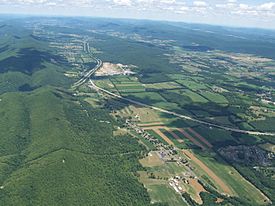 Aerial photo of Nittany Valley looking east. from Milesburg. Bald Eagle Mountain is on the left and Mount Nittany is at the upper right.