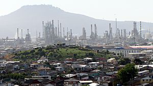 Panorama view of Hualpén, the Amarillo Hill (foreground), ENAP oil refinery, and  the Teta Biobío Norte Hill in background.