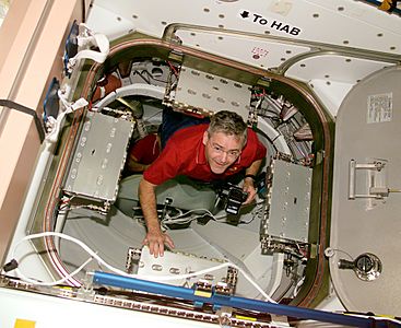 STS-97 Marc Garneau in the hatchway to PMA-3 (cropped)