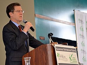 Kansas Governor Sam Brownback addresses during the Kansas Soybean Expo 2014