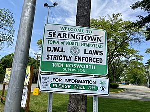 A welcome sign to Searingtown at the intersection of Herricks, Shelter Rock, and Searingtown Roads.