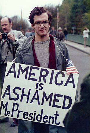 Visit by U.S. President Ronald Reagan to Bitburg military cemetery 1985, protester with transparent -0005