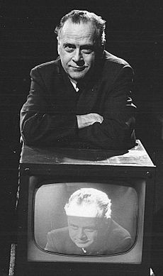 Marshall McLuhan with and on television (cropped)