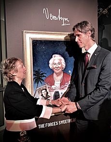 Dame Vera Lynn's daughter Virginia Lewis-Jones and Ross Kolby in front of his portrait of Lynn at the unveiling ceremony at the Royal Albert Hall on 13th January 2020
