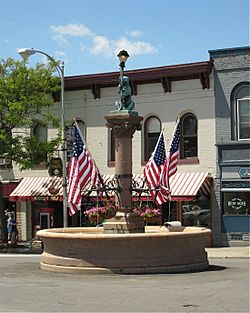 The Bear Fountain sits in the center of Geneseo's Main Street. In this picture, it is decorated with flags for Memorial Day.