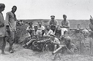 British and Indian machine gunners with a Vickers machine gun, Lewis gun and range-finder, 1917.jpg