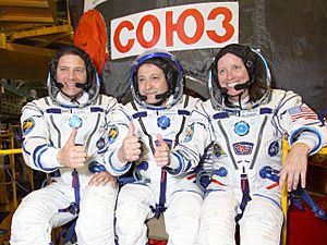 Soyuz TMA-19 Crew in front of the capsule (closeup)