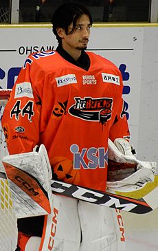 Ice hockey goaltender standing up looking to the right