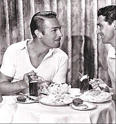 Randolph Scott and Cary Grant over a seafood lunch