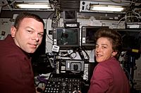 STS-114 James Kelly and Wendy Lawrence at Canadarm2 controls