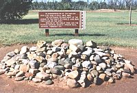 Pile of stone in front of informational sign