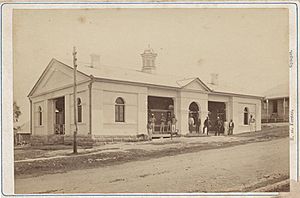 StateLibQld 2 299265 Men standing outside the courthouse in Gympie, 1870