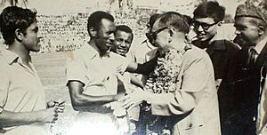 Pakistani footballer of the 1960s, Abdul Ghafoor Majna, shakes hands with the chief guest before a match