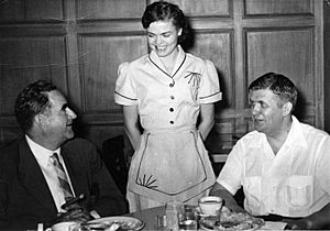 W. Kerr Scott (left); unidentified waitress; and Terry Sanford (right)