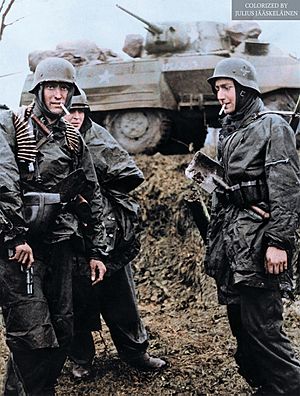Men from Kampfgruppe Hansen after a successful ambush on an American convoy of the 14th Cavalry group at Poteau, Belgium 1944. (48870616596)