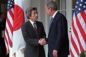 President George W. Bush and Prime Minister Junichiro Koizumi of Japan Shake Hands