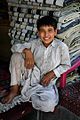Afghani boy carpet vendor
