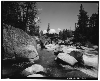 CONTEXTUAL VIEW OF BRIDGE IN ITS SETTING, LOOKING SOUTHEAST FROM DOWNSTREAM - Middle Fork Stanislaus River Bridge, Spans Middle Fork Stanislaus River at State Highway 108, HAER CAL,55-DARD.V,1-2.tif