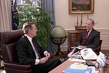 President George H. W. Bush meets with Secretary James Baker in the Oval Office of the White House