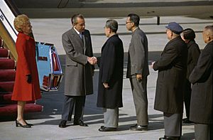 President Richard Nixon and Premier Chou En-Lai Shake Hands at the Nixons' Arrival in Peking, China