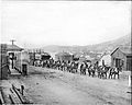 A burro-drawn wagon hauling lumber and supplies into Goldfield, Nevada, ca.1904 (CHS-5424)