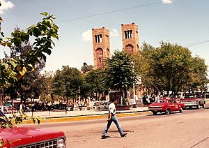 The Plaza Guillermo Baca in downtown Parral, showing the Searcher of Dreams Fountain and the Cathedral Shrine of Our Lady of Guadalupe, seat of the Diocese of Parral