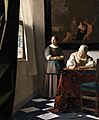 Woman writing a letter, with her maid, by Johannes Vermeer