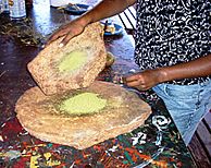 Aboriginal grain grinding. Uluru, (Ayers Rock), Australia