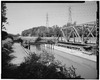 GENERAL VIEW LOOKING NORTH FROM TOWPATH, SHOWING WOOD-LINED TROUGH. AT RIGHT IS THE CANAL ROAD BRIDGE (1913). - Ohio and Erie Canal, Tinker's Creek Aqueduct, Canal Road, South HAER OHIO,18-VAVI,5-1.tif
