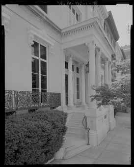 Detail view of the entrance to the Hackerman House; note the decorative ironwork at the windows as well as the ornamental window lintels that are supported by console brackets and topped HALS MD-1-41