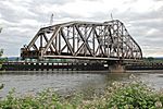Silver steel swingspan bridge with span turned