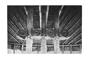 Interior Samoan fale tele with central pillars and curved rafters