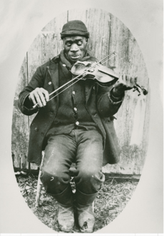'Joe Izzard playing the fiddle. Nova Scotia Archives