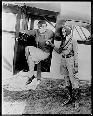 Miss Helen Hicks, 18-year-old golf star, and Elinor Smith, 17-year-old aviatrix, at Fairchild Field, Farmingdale, N.Y
