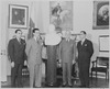 Photograph of President Truman receiving a marble bust of Simon Bolivar from a Venezuelan delegation in the Oval... - NARA - 199531.tif