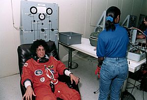 STS-71 Ellen Baker dons launch-entry suit (KSC-95EC-0907)