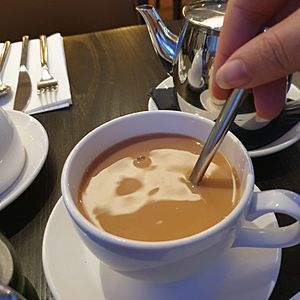 Stirring milk in Irish Breakfast tea