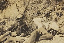 Snapshot by Ray Strachey of her brother, Lytton Strachey with Sydney Saxon-Turner, reclining at the beach