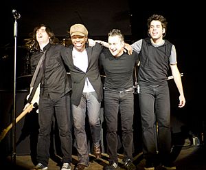Newsboys on stage for curtain call. From L. to R. Jody Davis, Michael Tait, Duncan Phillips, and Jeff Frankenstein.