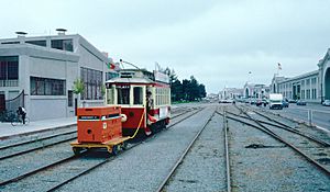 1987 SF Historic Trolley Festival - Porto 189 pushing generator cart on the Embarcadero
