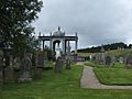 Cemetery in Lairg Scotland with James Matheson's tomb in background