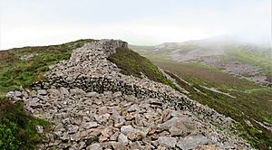 Inside the Celtic Iron Age hillfort of Tre'r Ceiri, Gwynedd Wales, with its 150 houses; finest in Europe 61