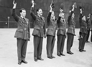 RAF pilots cheer King George VI at an awards ceremony at RAF Hornchurch, 27 June 1940. CH432
